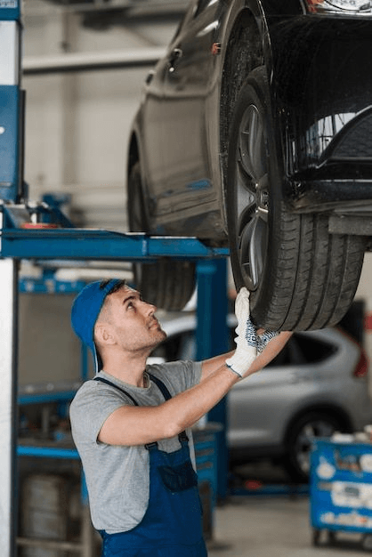 Mechanic inspecting a vehicle